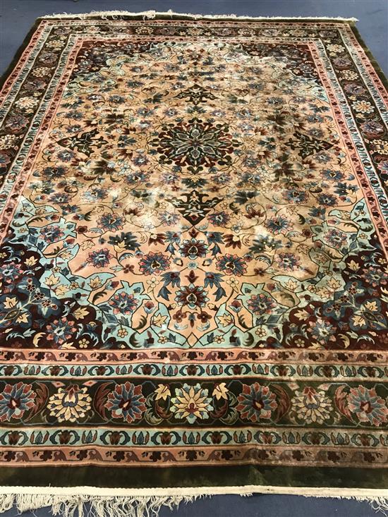 A Chinese silk pink ground carpet 370cm x 275cm